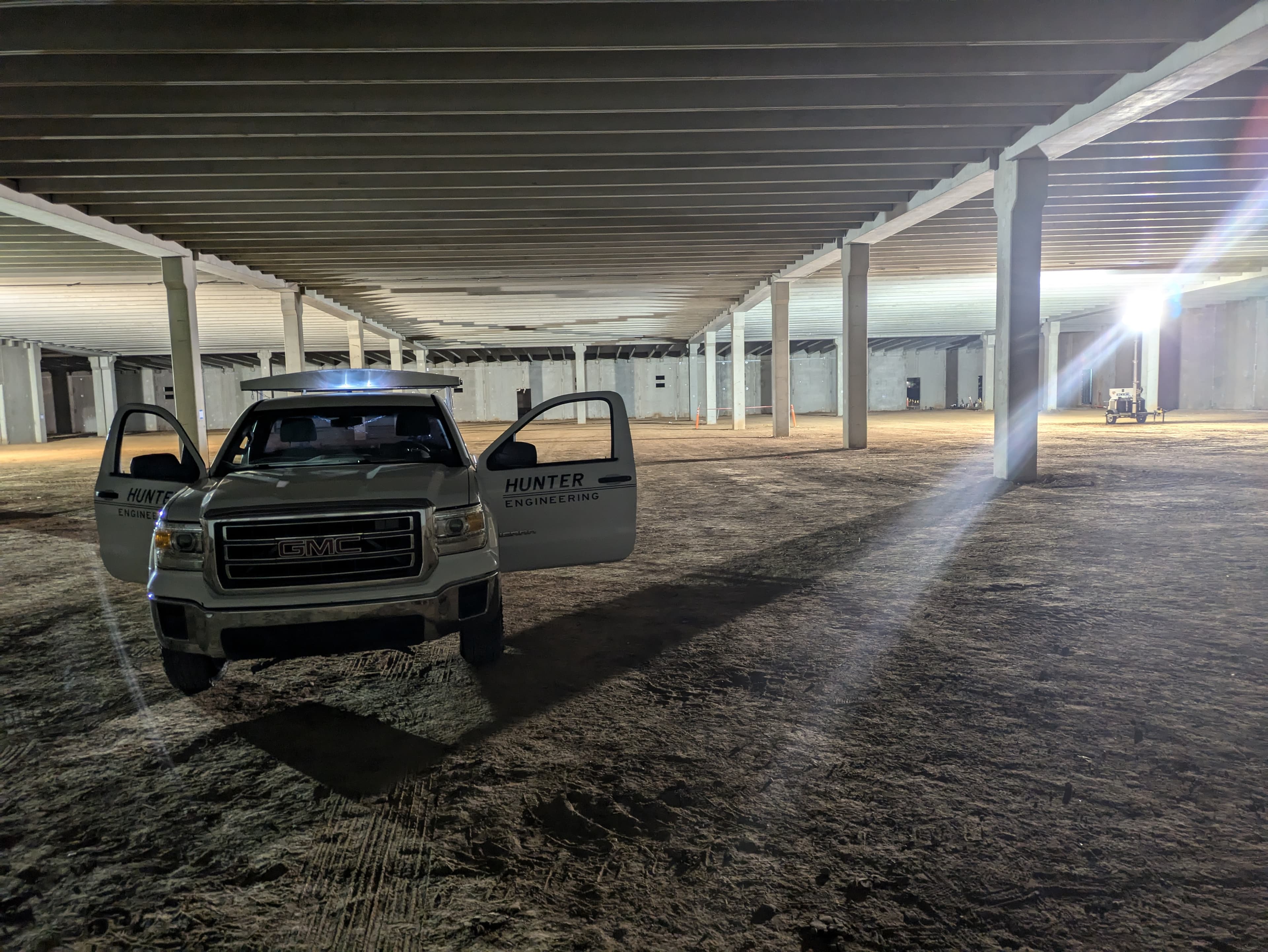 Hunter Engineering truck at industrial construction site at night